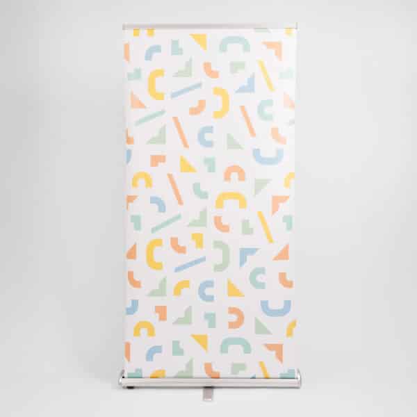 silver roller banner stand with geometric printed pattern
