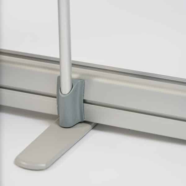 a detail of how the pole fixes to the base hardware of a roller banner stand