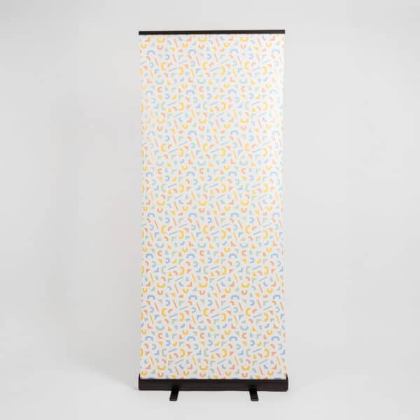Black roller banner stand with geometric printed pattern